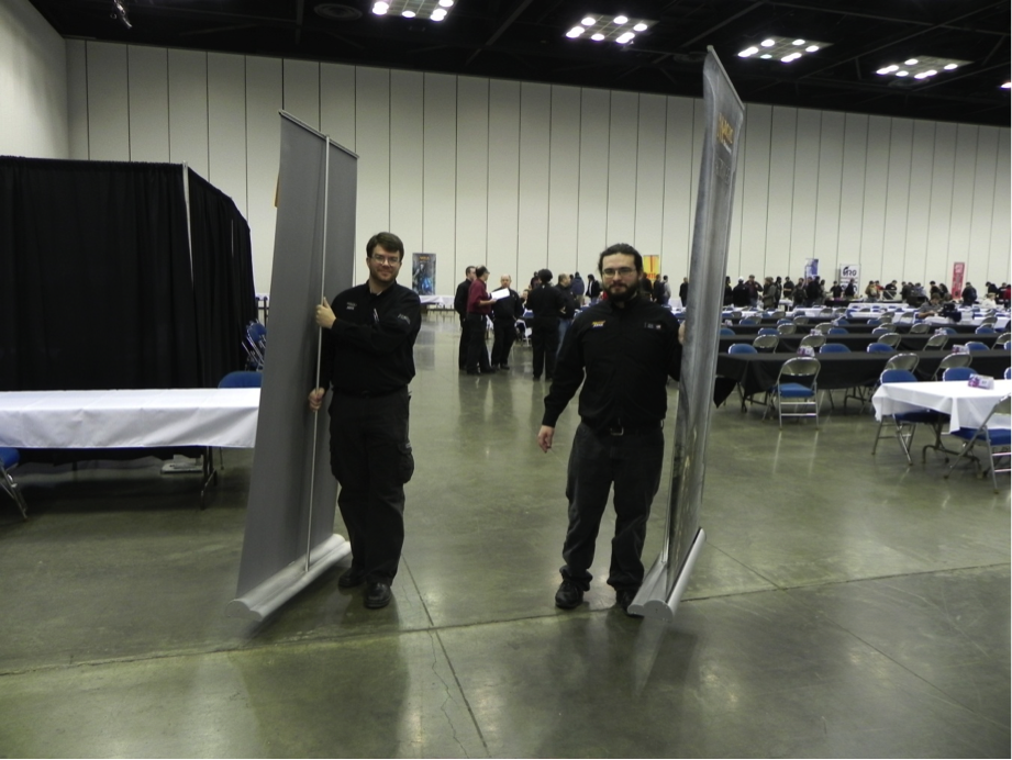 The paper team distributing pairing boards