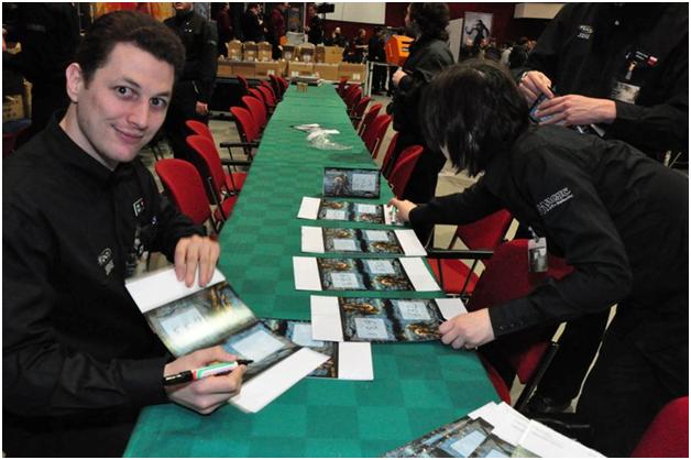 Jeremie Granat and Claire Dupré writing table numbers at GP—Bochum ‘10