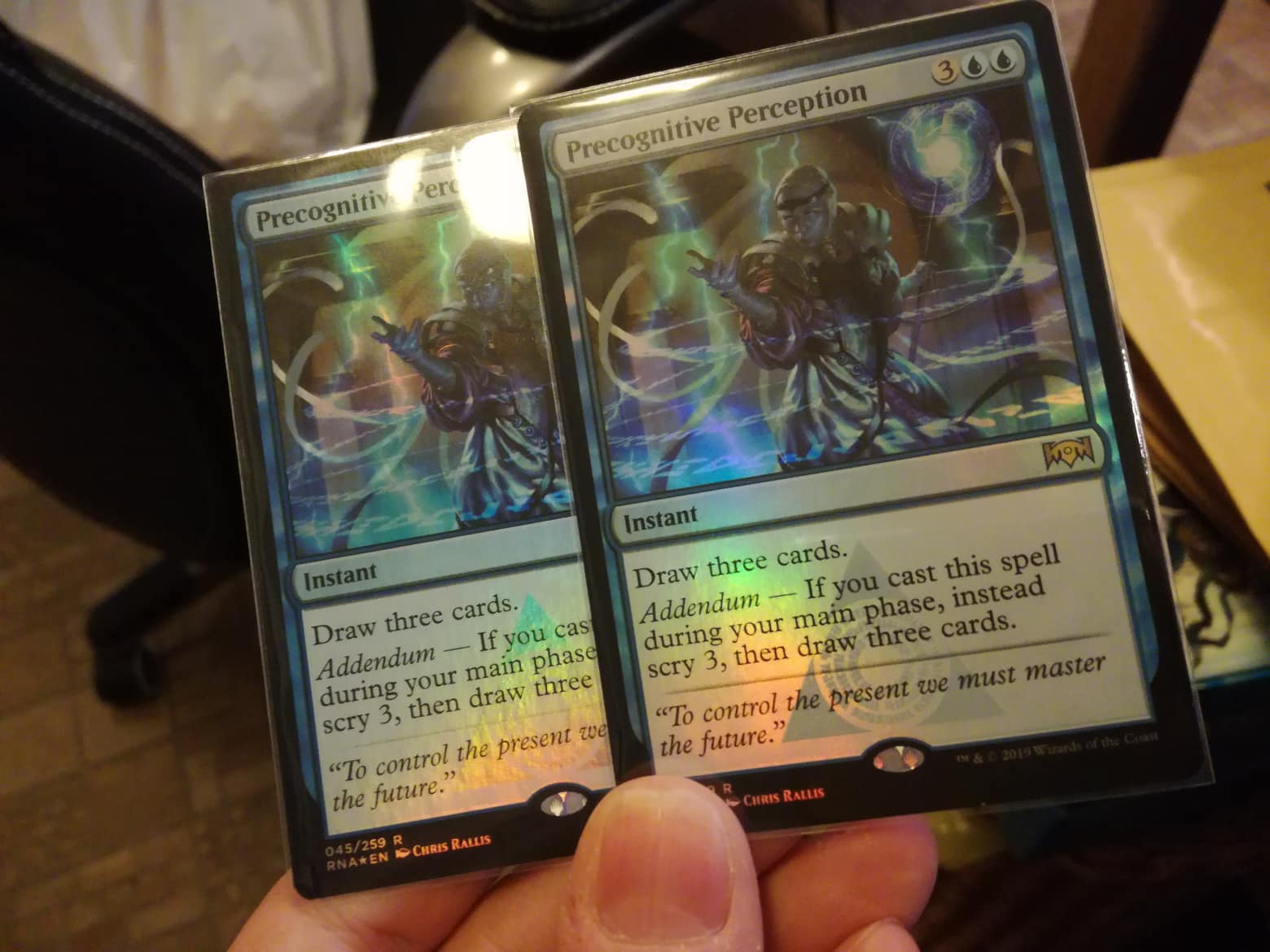Two foil cards, side by side