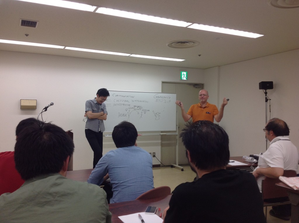 We interrupt the questions with a picture of Christian Gawrilowicz (L3) giving a seminar at the conference with Kenji Suzuki (L3) translating. 